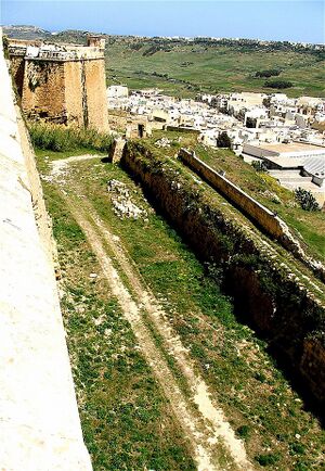 An image of ruined fortress walls in the Kevan River Valley, remnants of the once-powerful Mvanagaz kingdom that collapsed around 2197 BCE.
